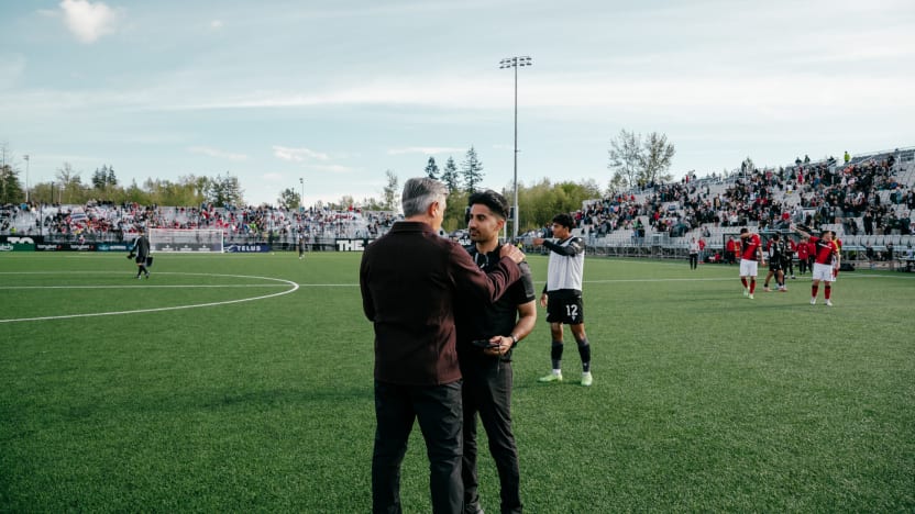 Jeevin Kang with Vancouver FC head coach Afshin Ghotbi (Photo: Beau Chevalier / Vancouver FC)