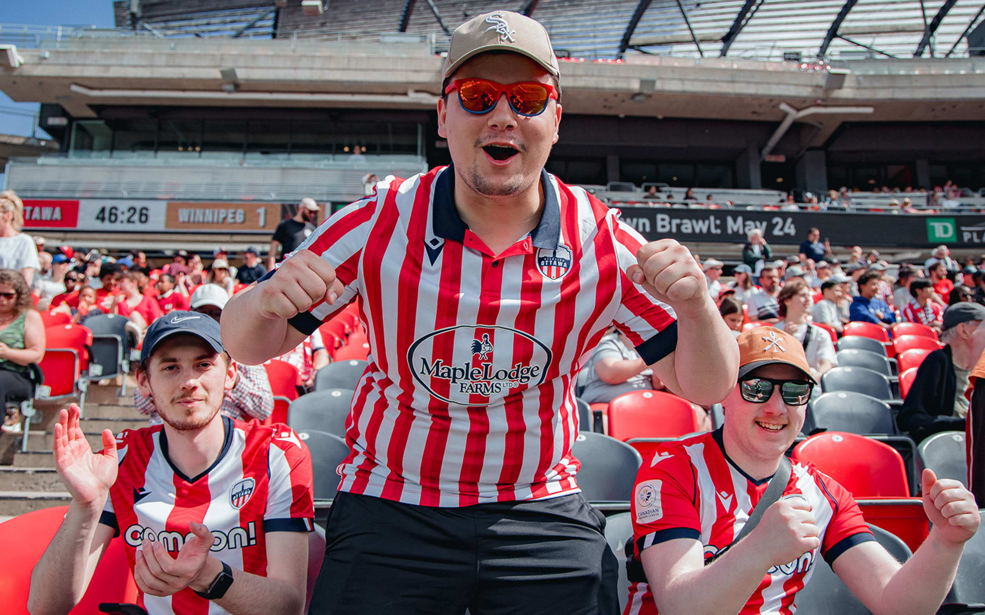 3 young men cheering